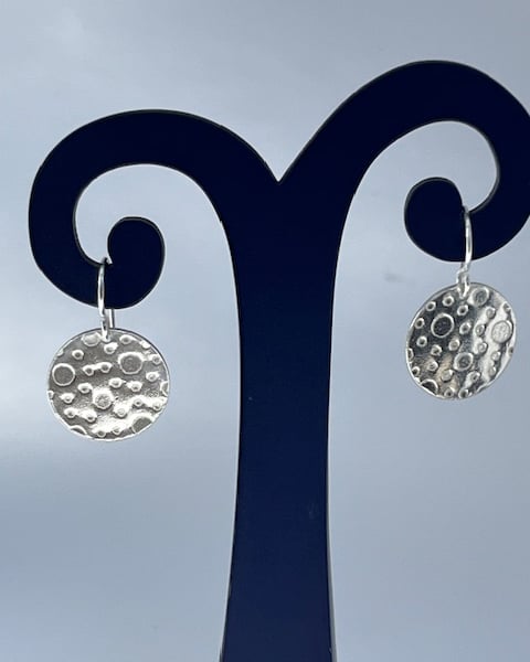 Silver round earrings with bubbles texture