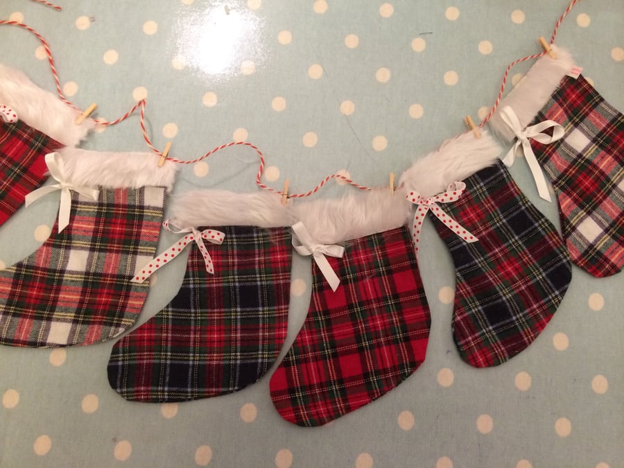 christmas tartan  stocking garland in christmas fabrics and fur trim with twine