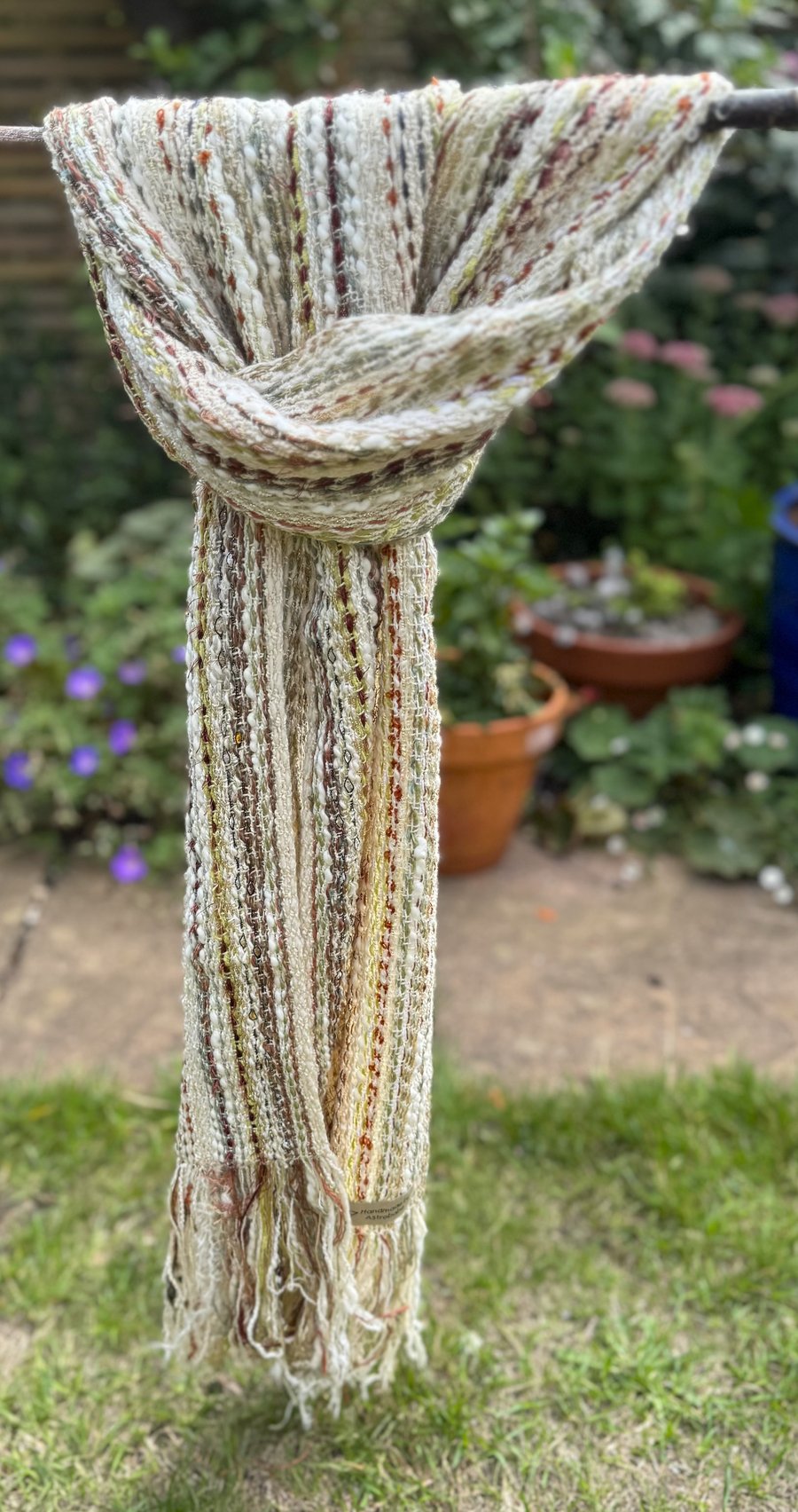 Stripey scarf in syncopated green, cream and rusty brown
