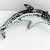 black and white dolphin brooch