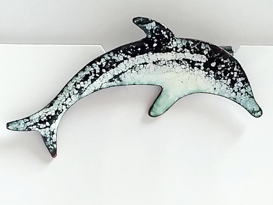 black and white dolphin brooch