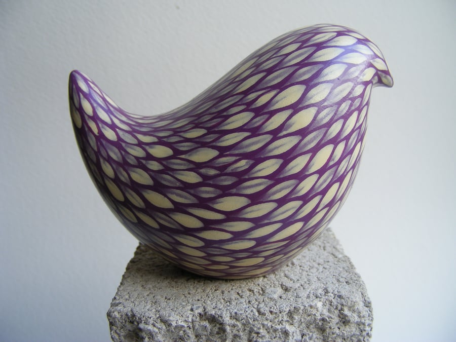 Painted bird. Cream on blackberry (E)