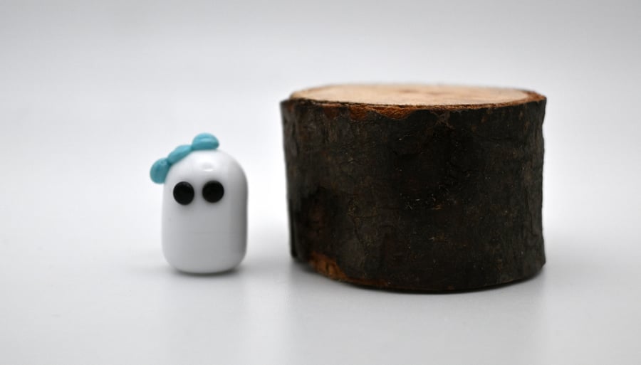 small glass ghost figure