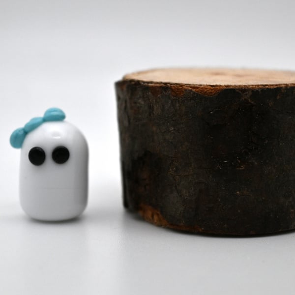small glass ghost figure