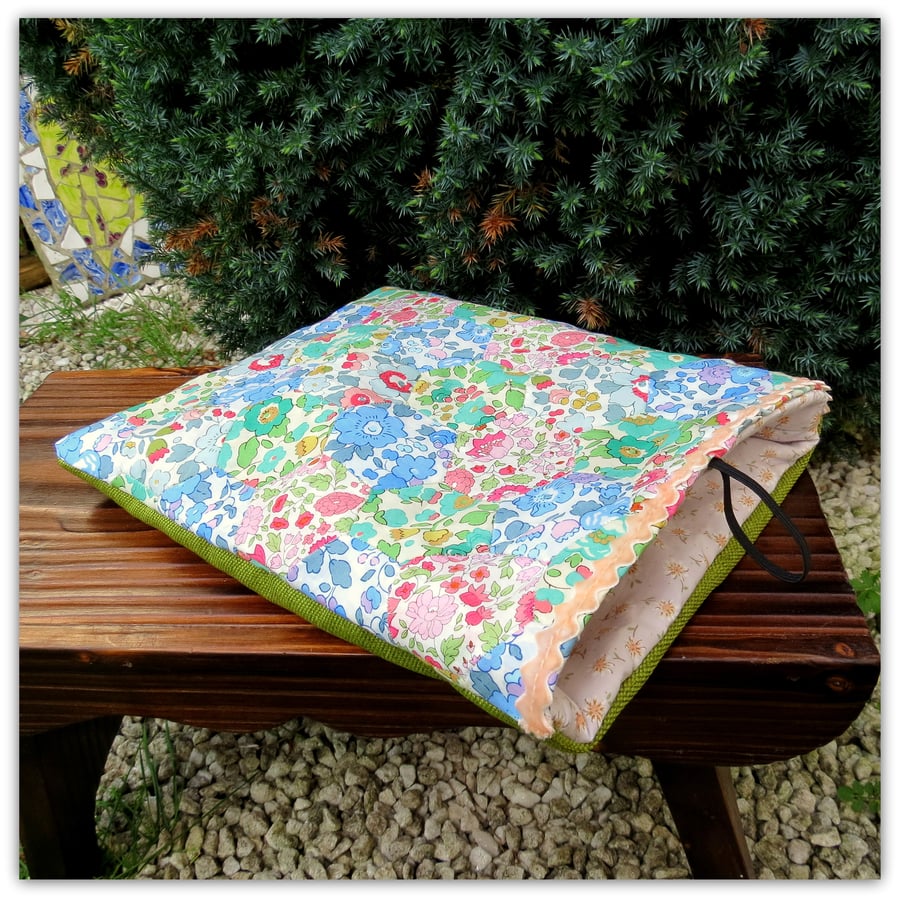 A Liberty Lawn patchwork ipad sleeve.  Handsewn patchwork in a hexagon design.