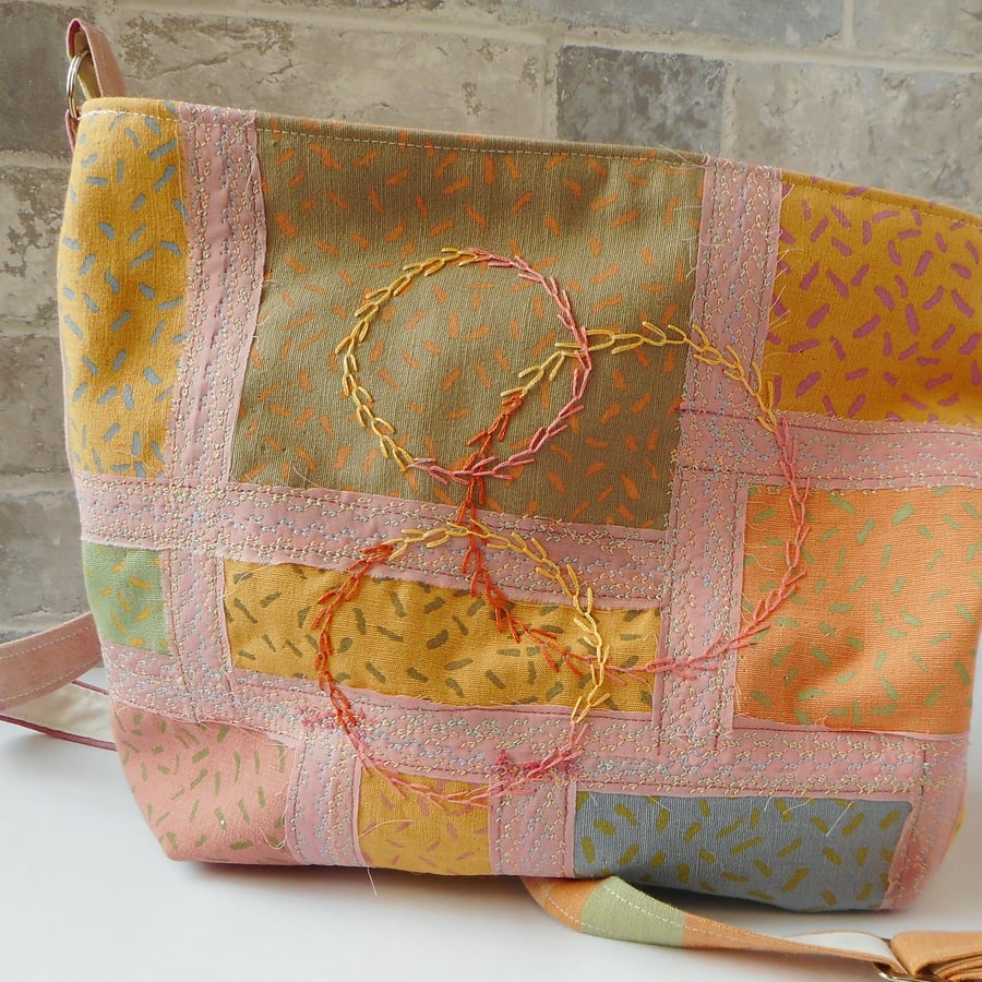 Fabric bucket bag with machine and hand embroidered details