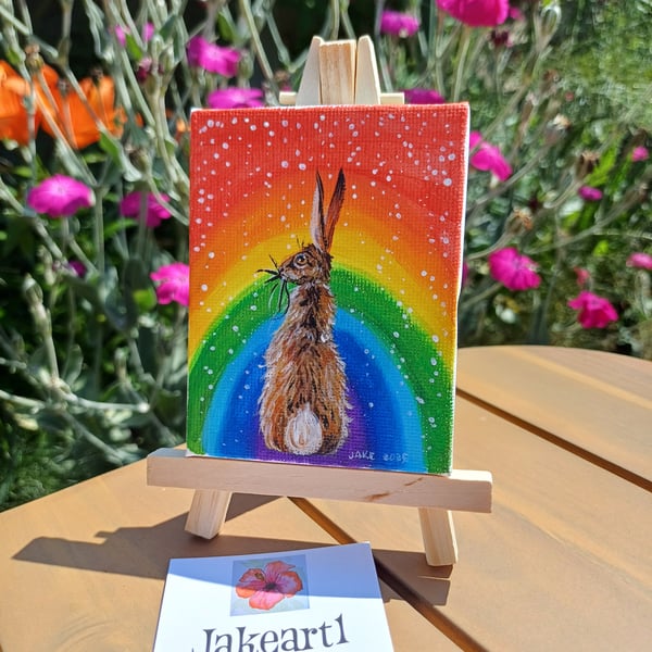 Rainbow hare miniature acrylic painting on easel