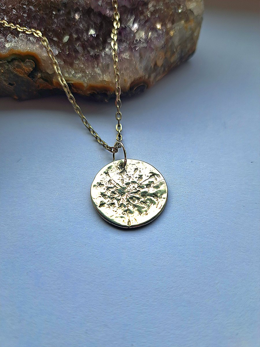 silver nature inspired imprinted round pendant