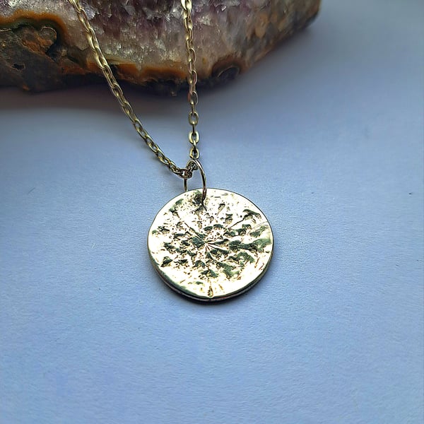 silver nature inspired imprinted round pendant