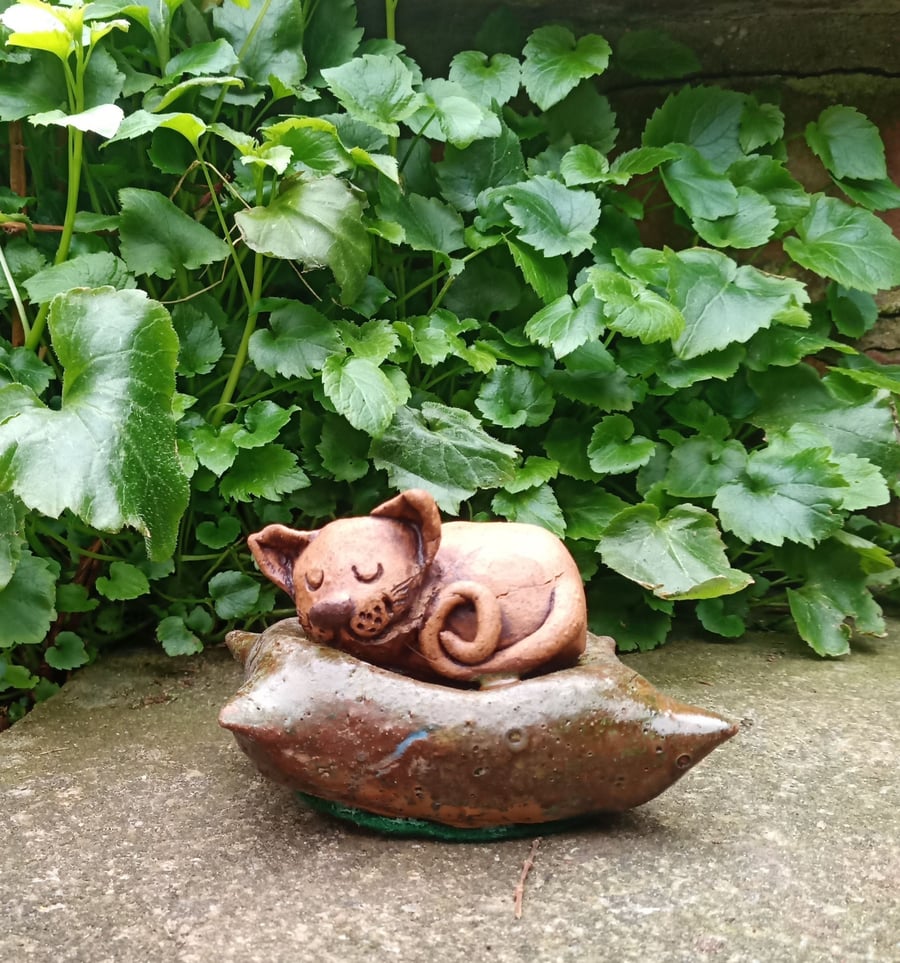 Ceramic cat on cushion
