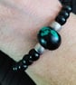 Black acrylic beads with a Black and Turquoise centre