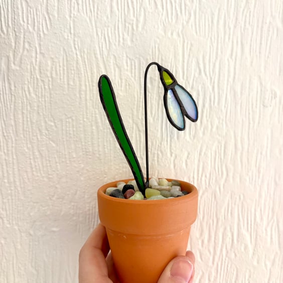 Iridescent white stained glass snowdrop in a pot, handmade flowers