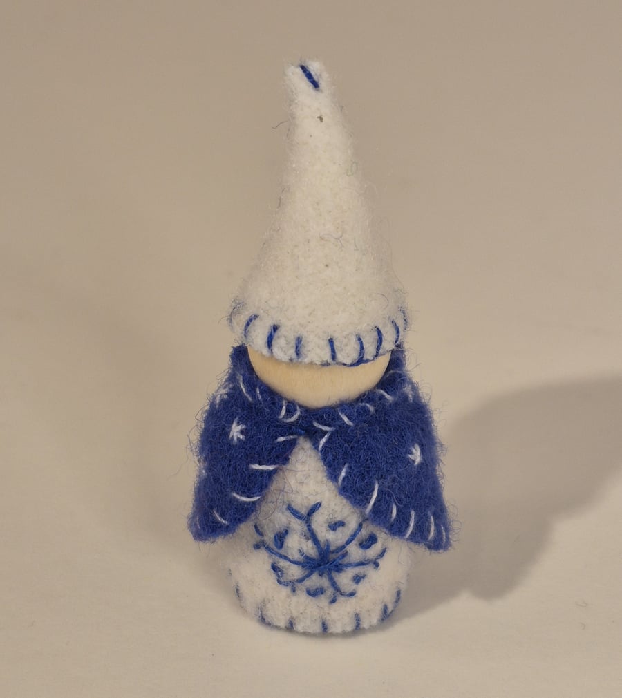 Small wintery gnome with snowflake decorations
