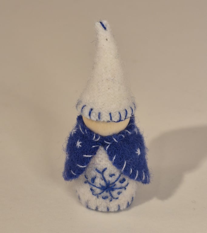 Small wintery gnome with snowflake decorations