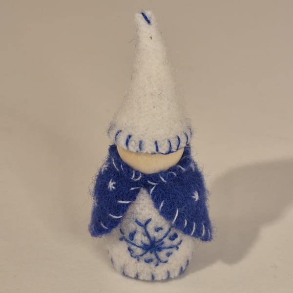 Small wintery gnome with snowflake decorations