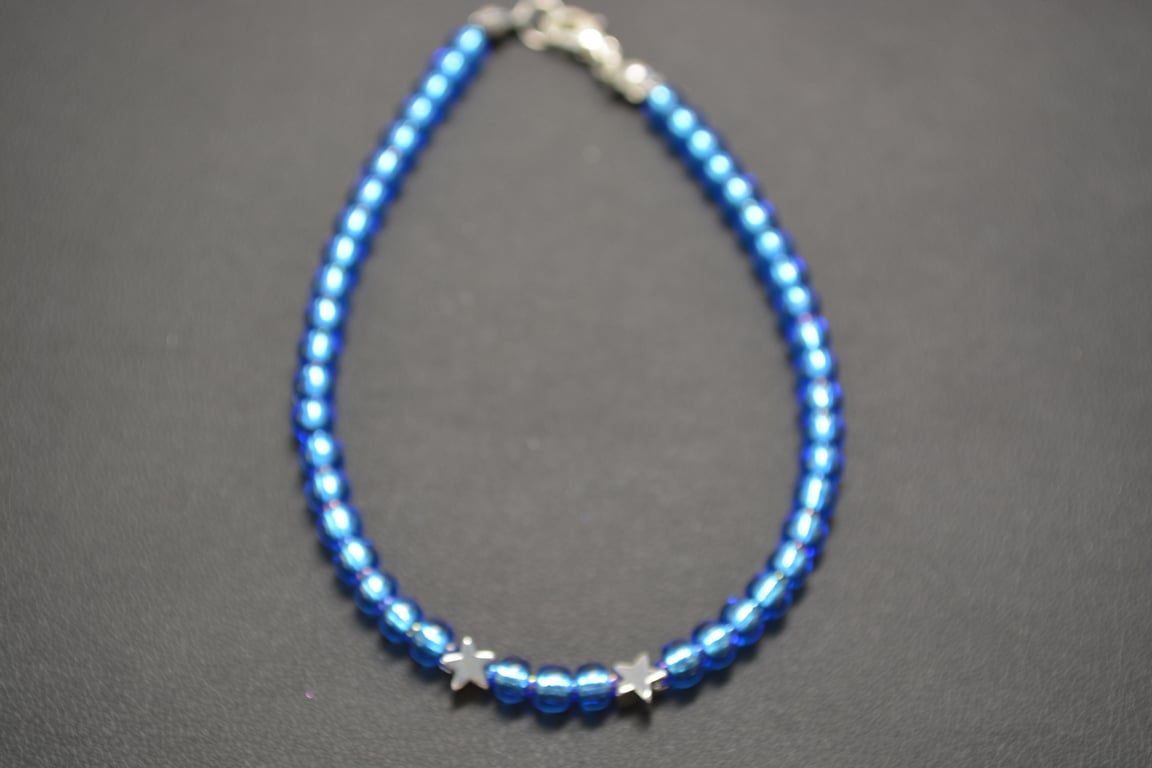 Light blue seed beaded bracelet with silver stars
