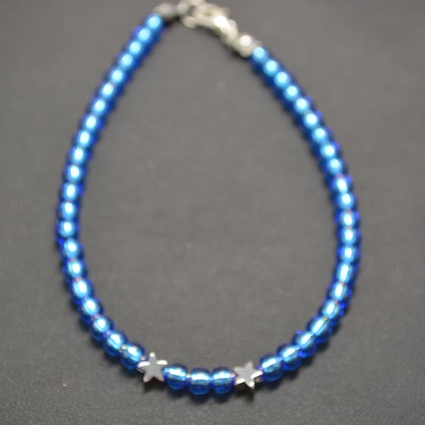 Light blue seed beaded bracelet with silver stars