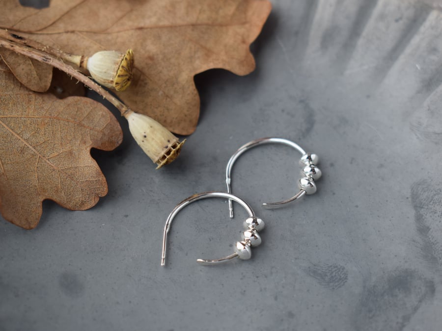 Silver hoop stud earrings with charms