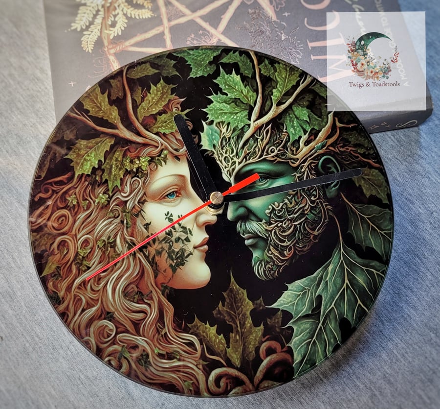 The green man and forest lady glass clock 