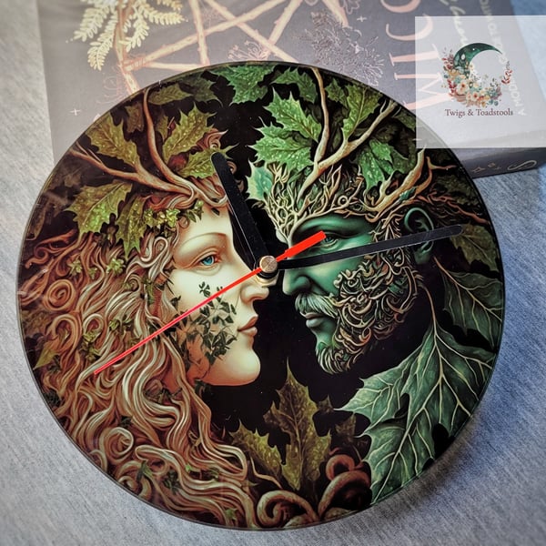 The green man and forest lady glass clock 