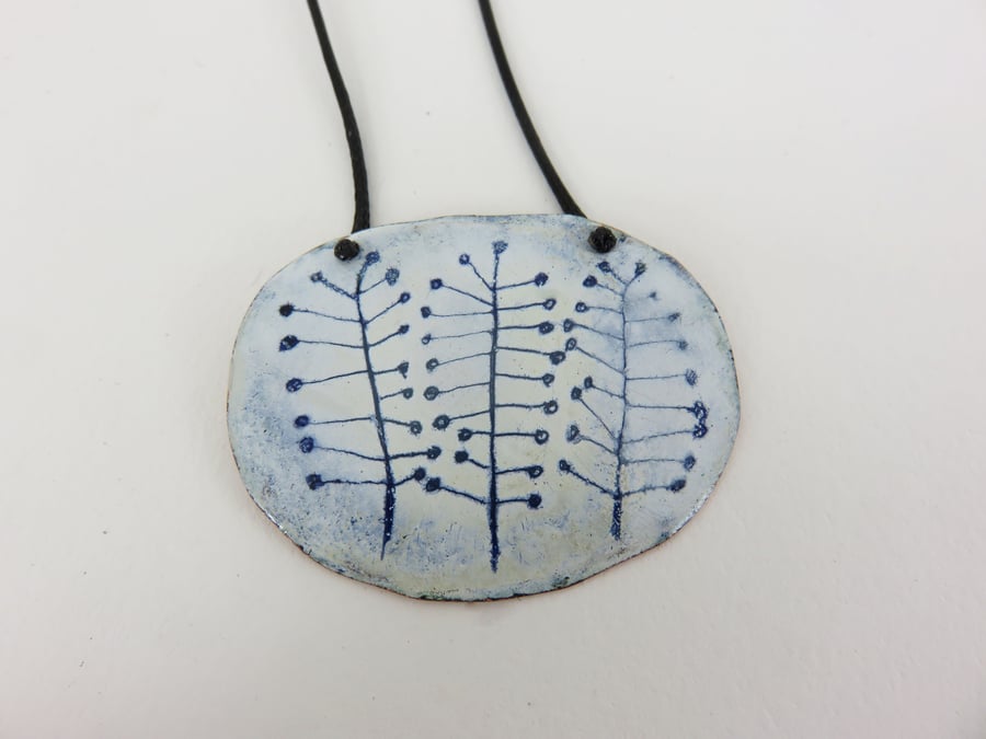 Oval domed hand drawn plant pendant in copper and enamel