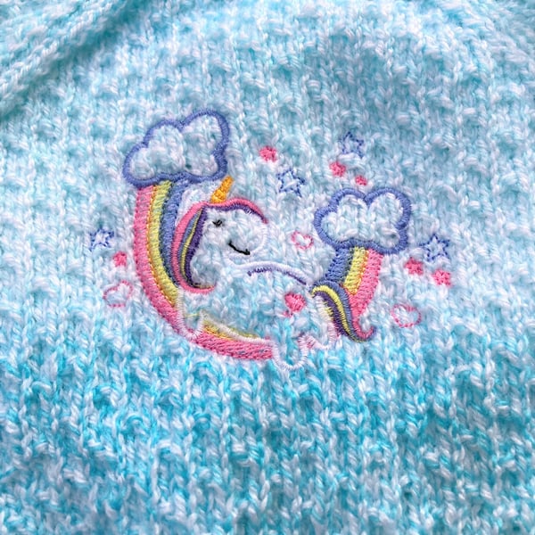 Hand knitted baby cardigan 0 - 6 months in turquoise with unicorn feature