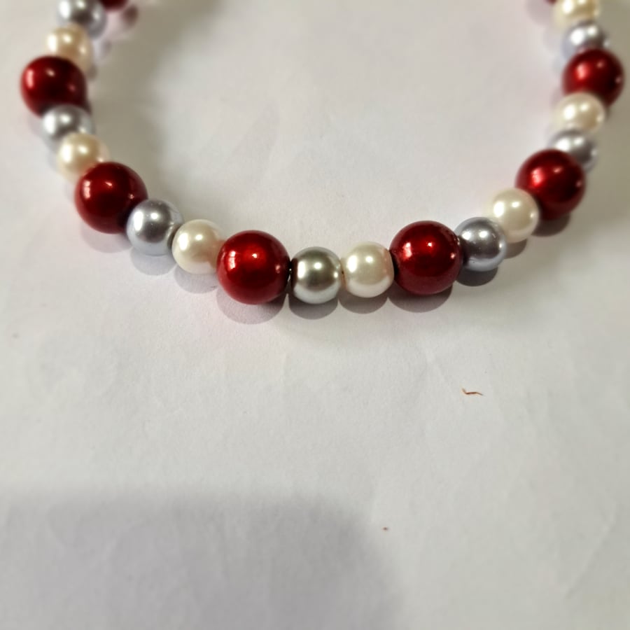 Red, white and silver beaded wired bracelet, lobster clasp