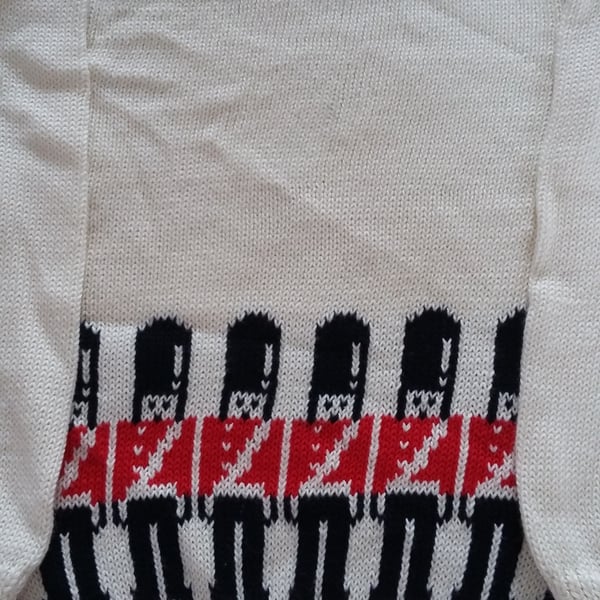 Soldier jumper with guardsmen round the bottom. Machine washable wool or cotton
