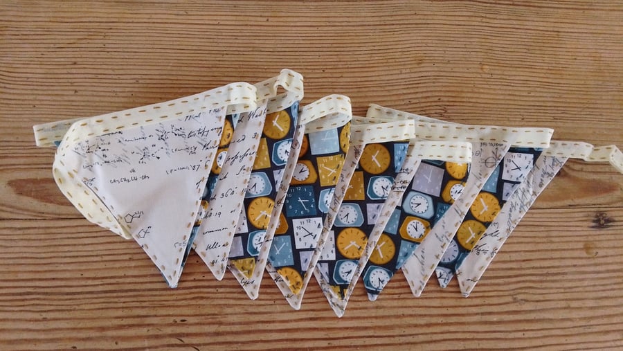 Handmade mini bunting with a clock and writing theme.