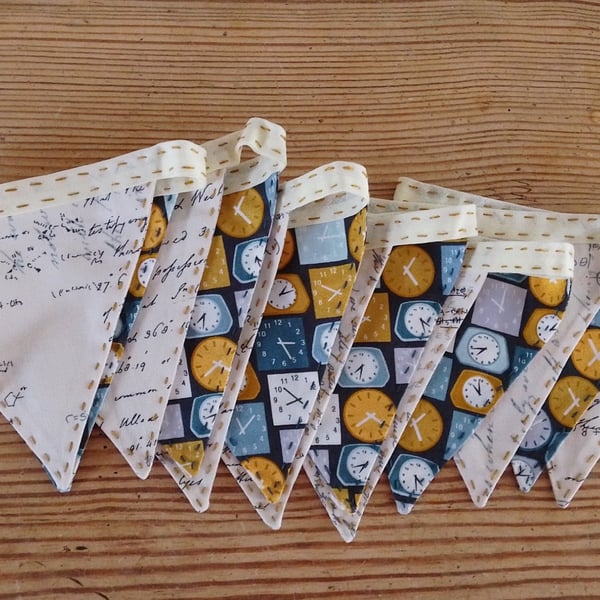 Handmade mini bunting with a clock and writing theme.