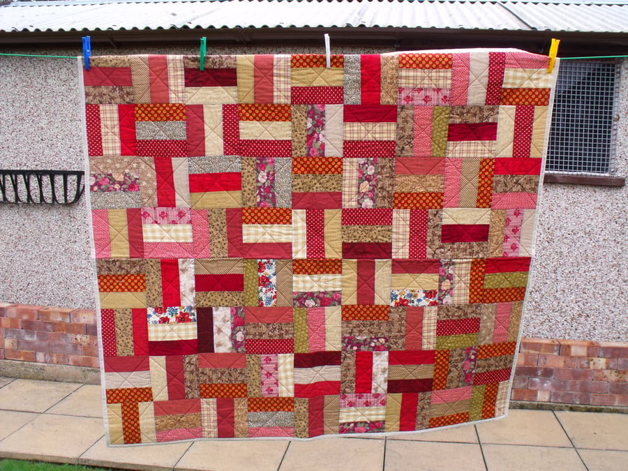 rail fence patchwork quilt in autumnal colours, quilted sofa throw