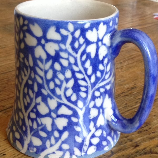 Mug with blue and white floral decoration. Free uk postage