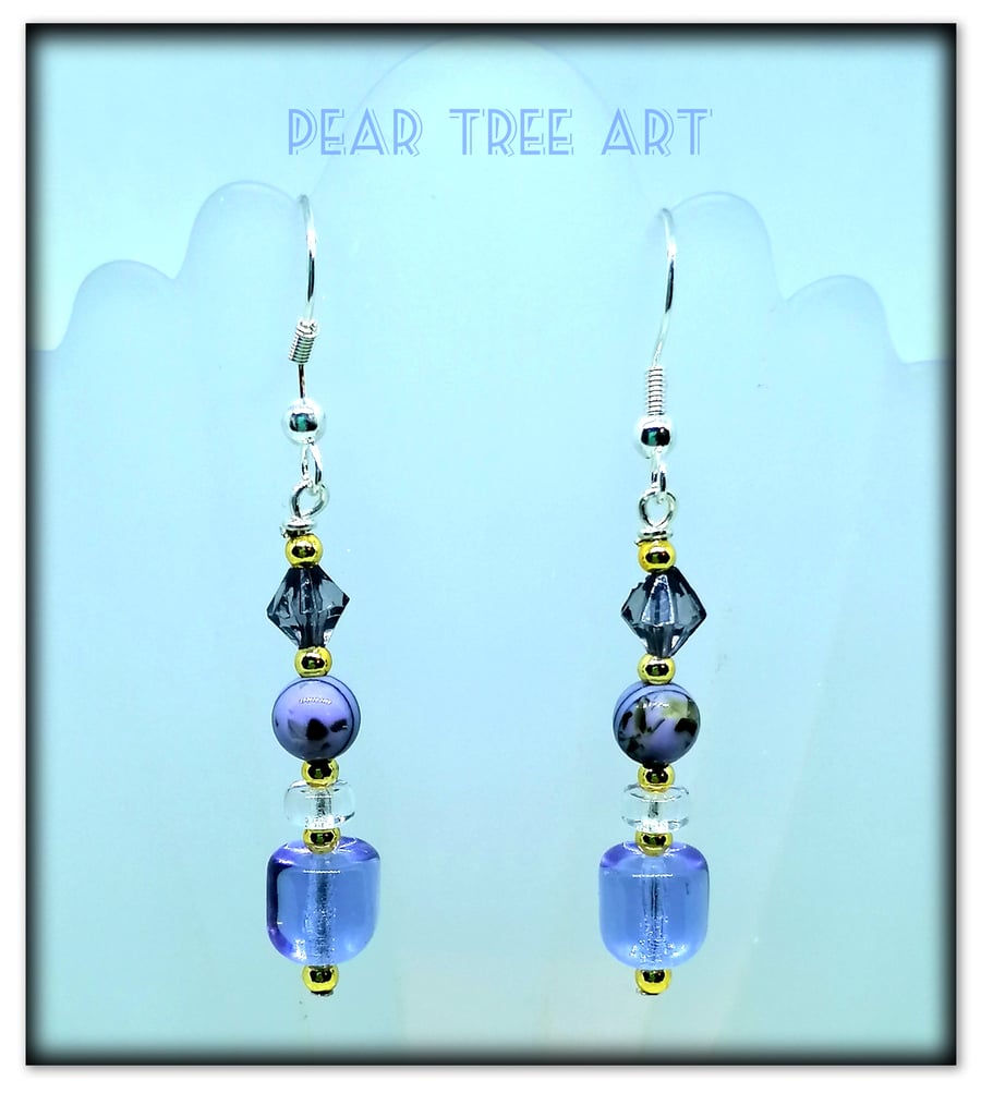 Purple glass drop earrings on Silver plated hooks.