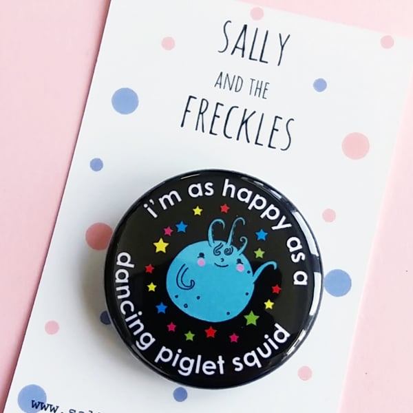 badge - i'm as happy as a dancing piglet squid - 38mm pin badge