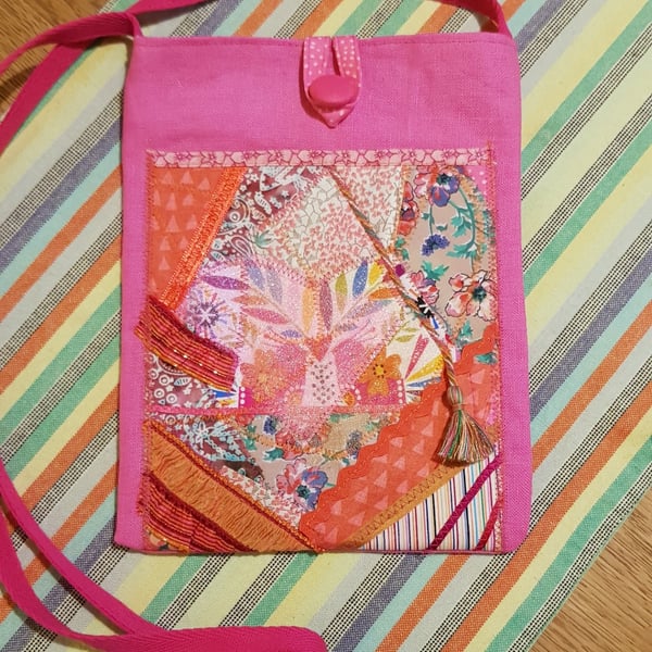 Crossbody bag; textile art on pink 