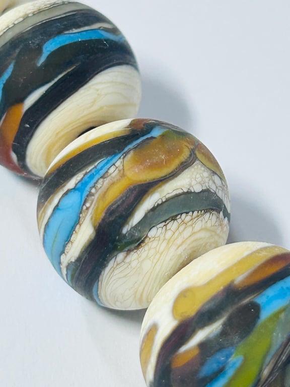 Handmade ivory, brown and turquoise lamp work glass beads