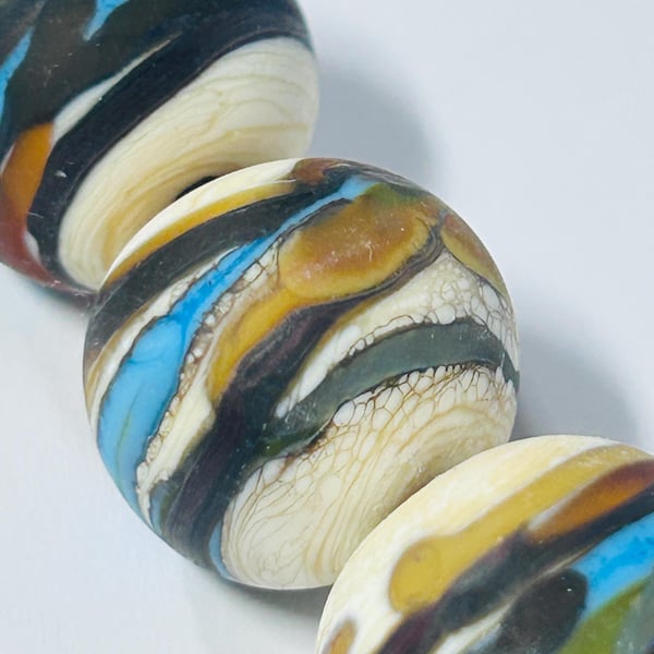 Handmade ivory, brown and turquoise lamp work glass beads