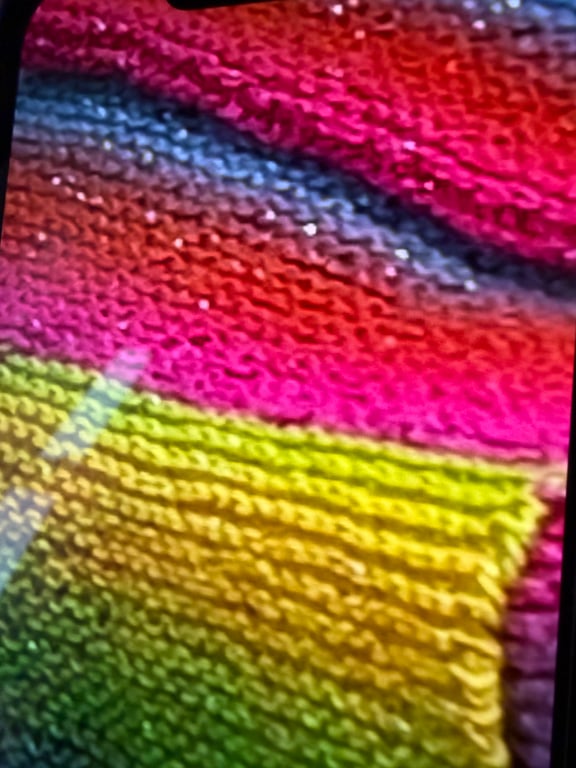 Hand knitted sparkly fringed scarf.