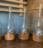 Upcycled wine bottle tea light holder