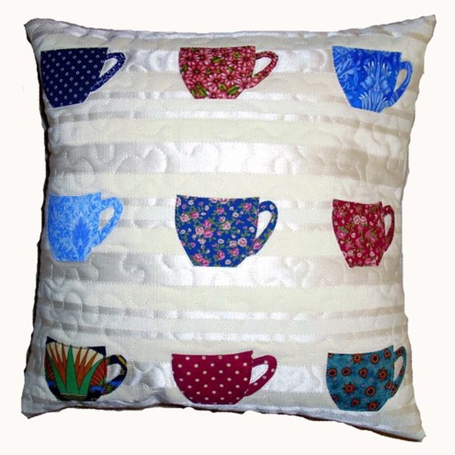 Appliqued cushion with tea cups