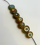 Handmade brown, ivory and turquoise patterned lamp work glass beads - Image 7