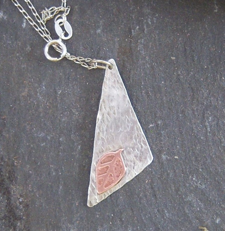 Triangle and leaf in letured sterling silver and etched copper