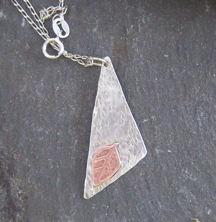Triangle and leaf in textured sterling silver and etched copper