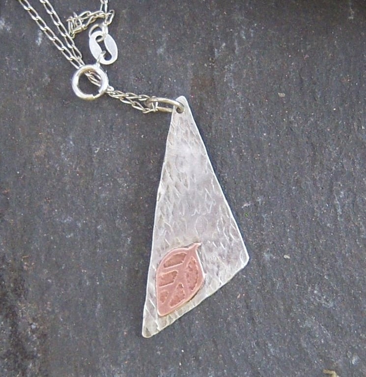 Triangle and leaf in textured sterling silver and etched copper