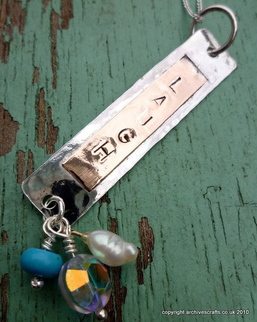 Word tag pendant necklace