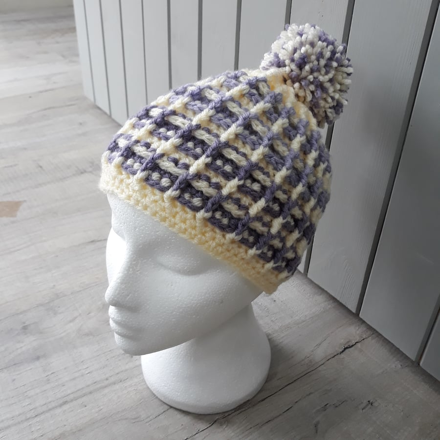 Purple and cream pompom crochet hat