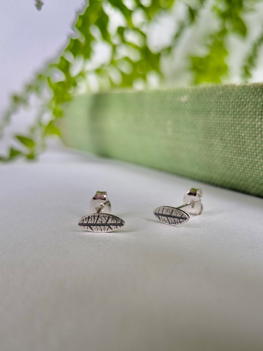 Mini leaf sterling silver stud earrings with leaf printed detail