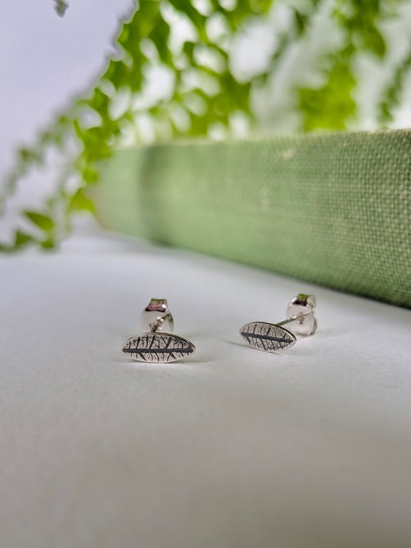 Mini leaf sterling silver stud earrings with leaf printed detail