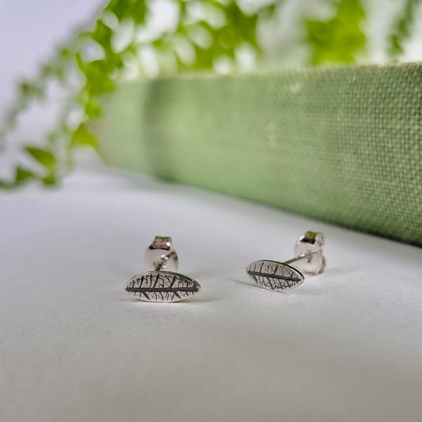 Mini leaf sterling silver stud earrings with leaf printed detail