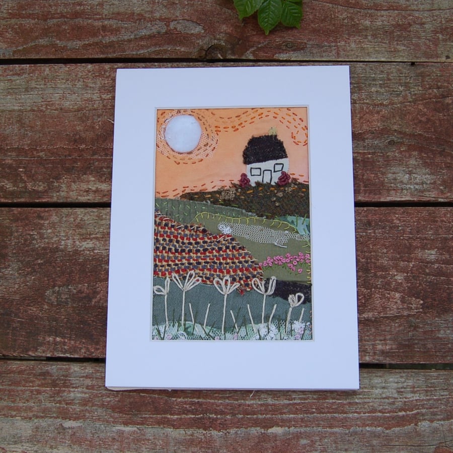 Early morning sunrise.  Upcycled fabric hand stitched picture 
